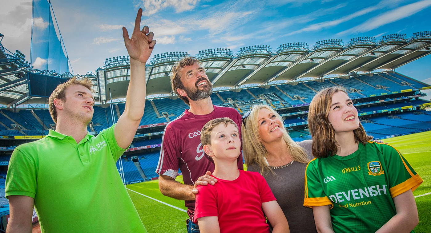 image of a tour guide showing a family around croke park stadium